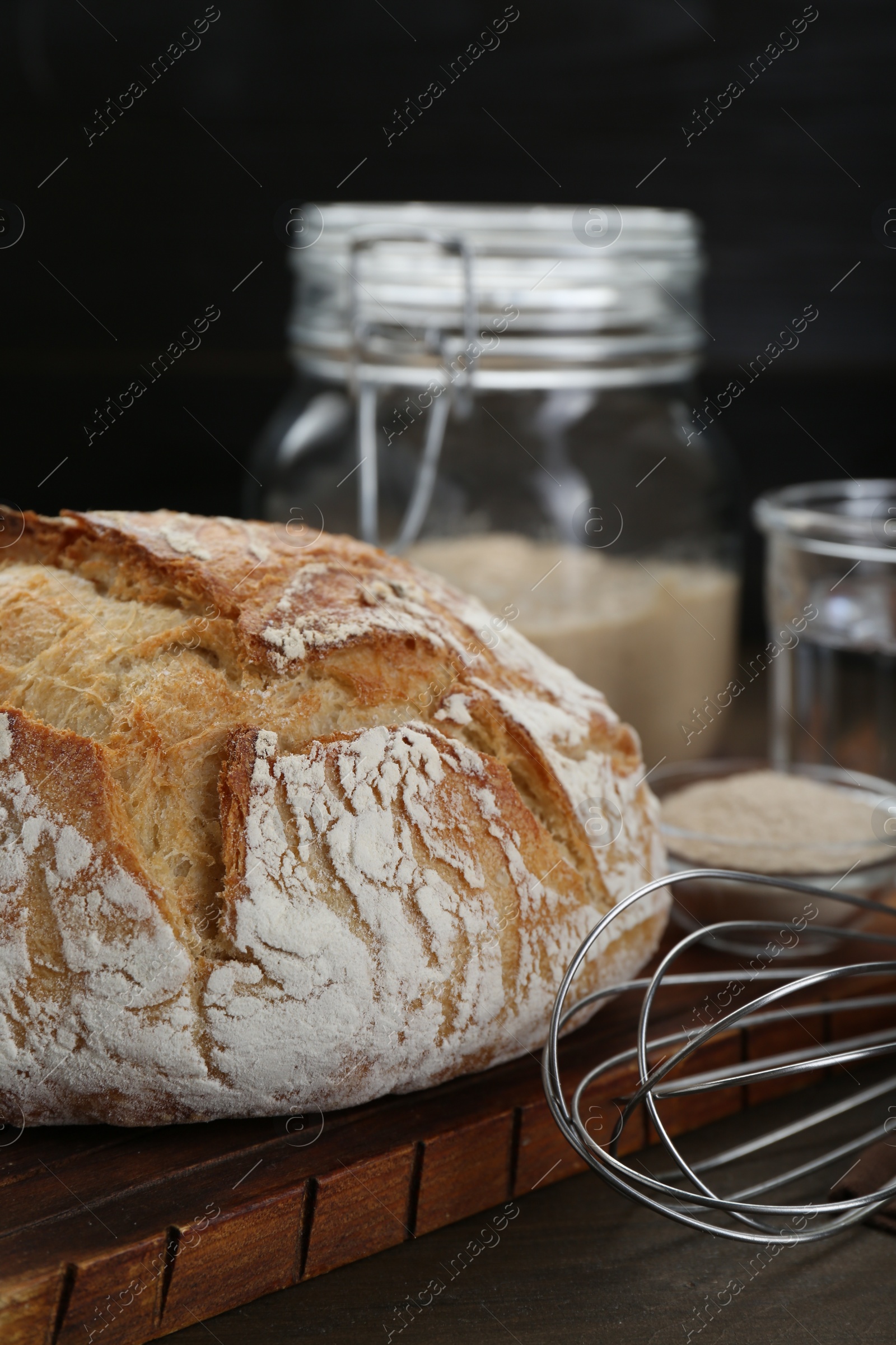 Photo of Freshly baked sourdough bread on wooden table