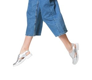 Photo of Woman in stylish shoes jumping on white background