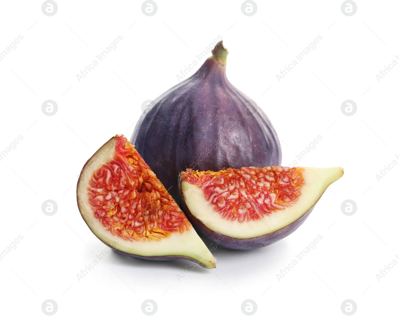 Photo of Whole and cut purple figs on white background