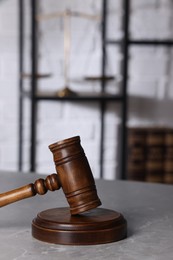 Photo of Law concept. Judge's gavel on light grey marble table indoors