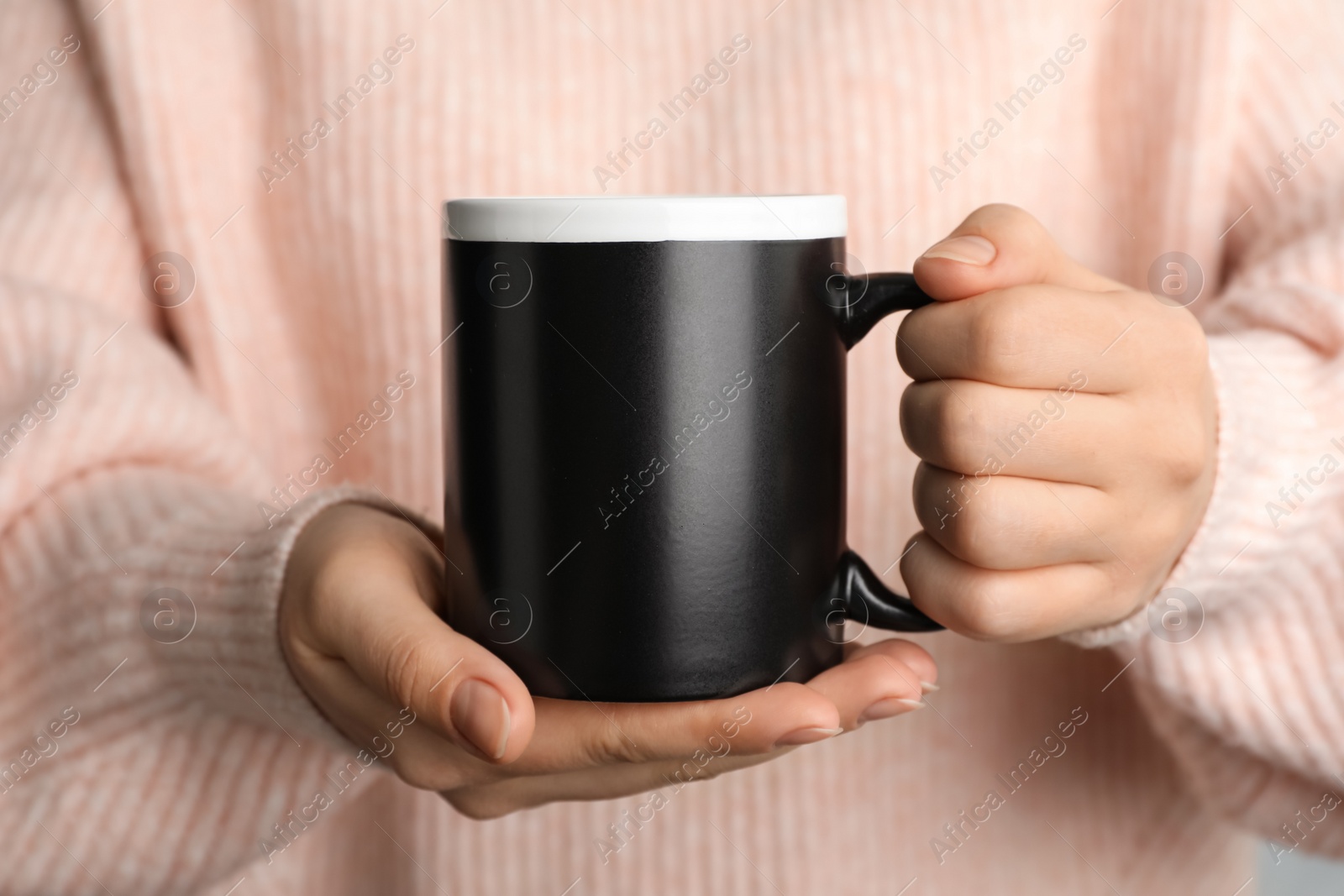 Photo of Woman holding mug of hot drink, closeup. Coffee Break