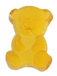 Photo of Delicious yellow gummy bear candy isolated on white