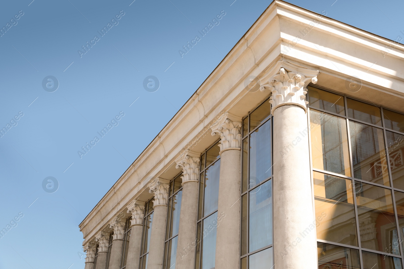 Photo of Supreme court building with pillars. Law and justice