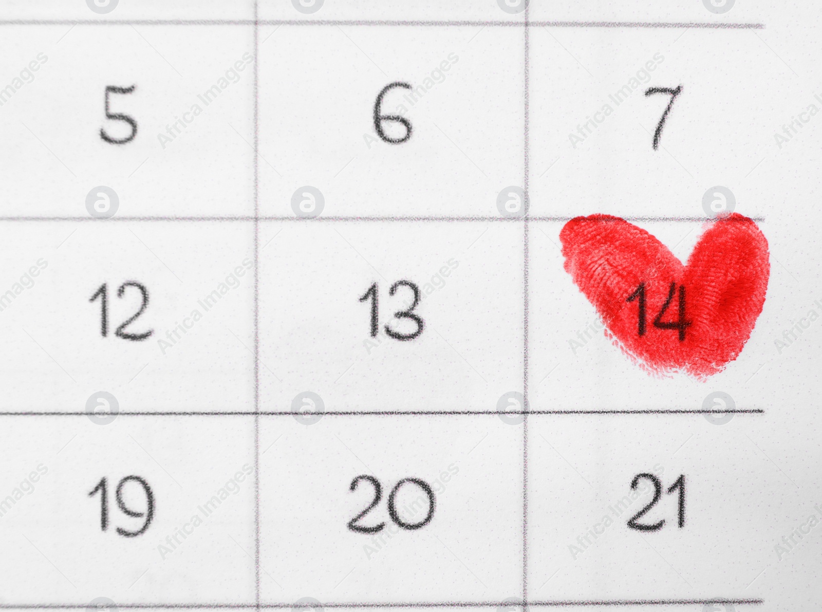 Photo of Valentine's day marked with red fingerprints on calendar sheet, top view
