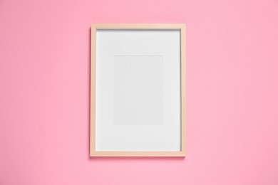Photo of Empty photo frame on beige background, top view. Space for design