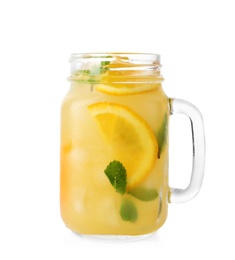 Photo of Mason jar of orange refreshing drink with mint on white background