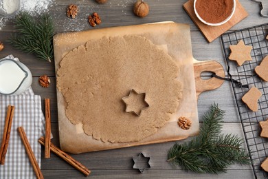 Photo of Homemade Christmas cookies. Flat lay composition with dough on wooden table