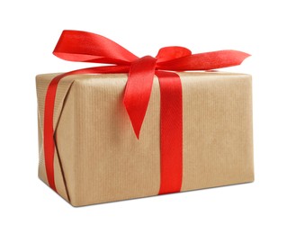 Photo of Christmas gift. Box wrapped in kraft paper on white background