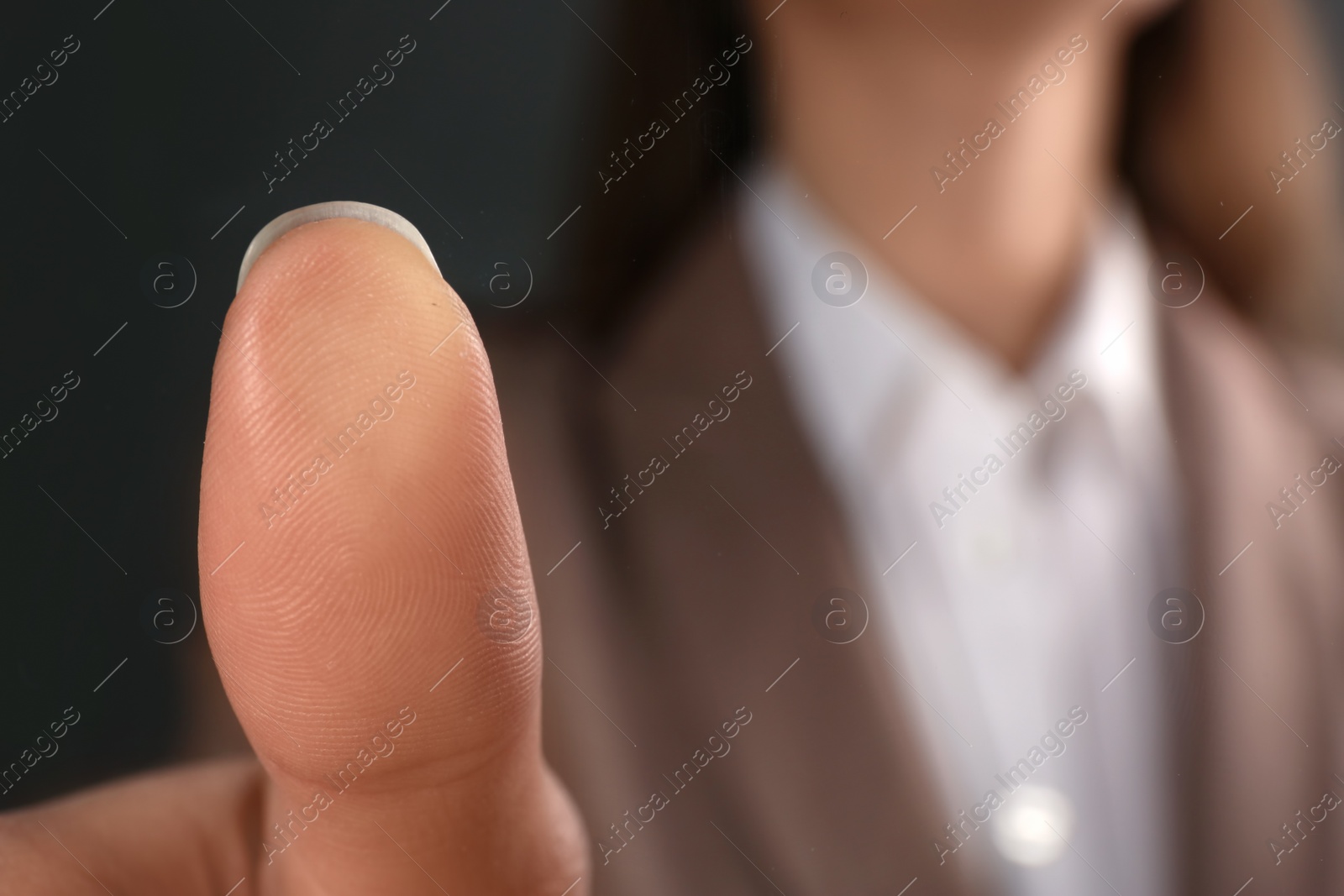 Photo of Businesswoman pressing control glass of biometric fingerprint scanner, closeup. Space for text