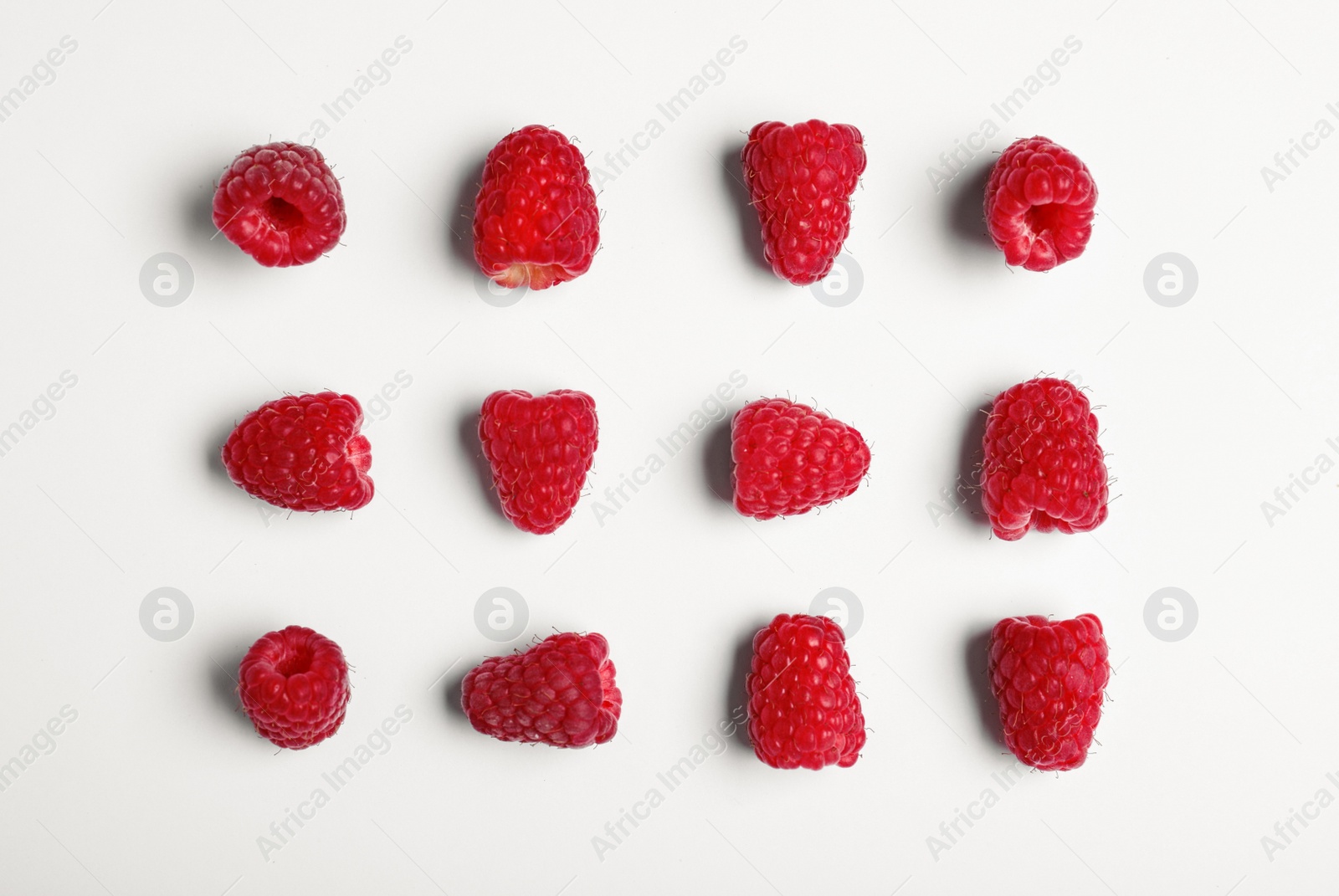 Photo of Composition with delicious ripe raspberries on white background, top view