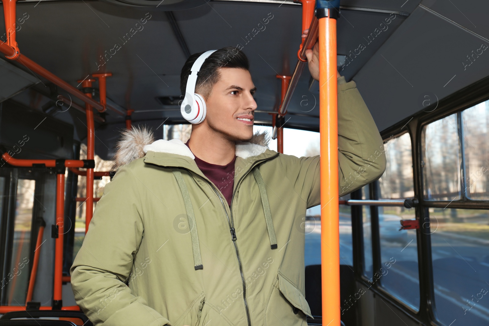 Photo of Man listening to audiobook in trolley bus