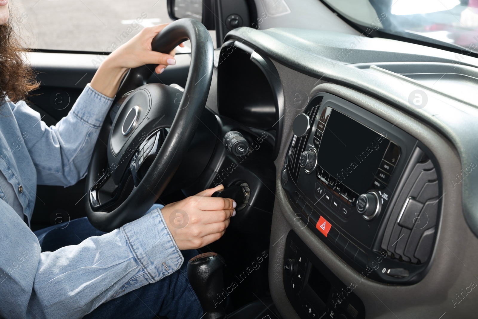 Photo of Driving school. Woman on driver's seat in modern car, closeup