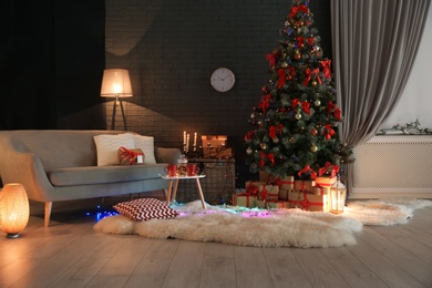 Photo of Stylish room interior with decorated Christmas tree