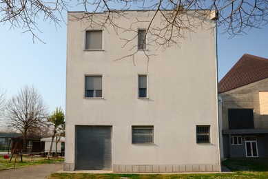 Simple white building exterior on sunny day