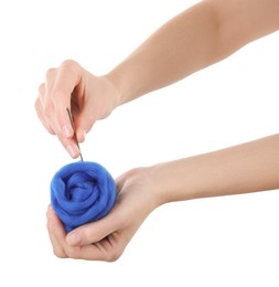 Photo of Woman needle felting from wool on white background, closeup