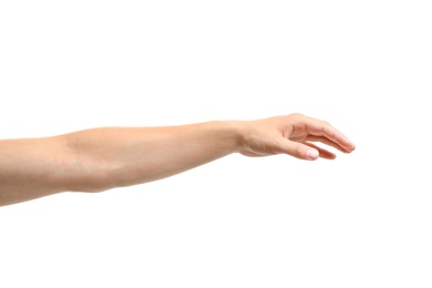 Young man held out hand on white background, closeup