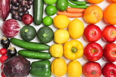 Photo of Rainbow composition with fresh vegetables and fruits as background