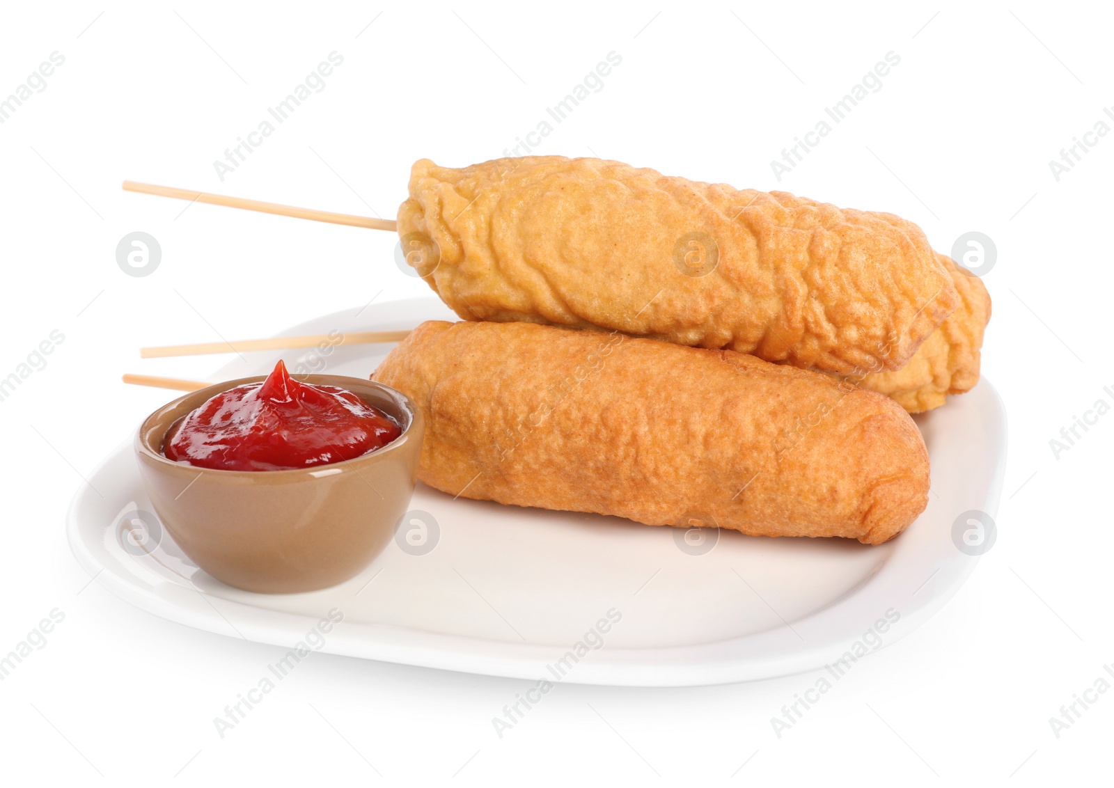 Photo of Delicious deep fried corn dogs with ketchup on white background