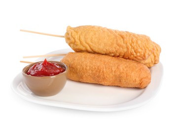 Photo of Delicious deep fried corn dogs with ketchup on white background