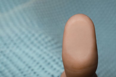 Woman pressing finger to surface, closeup view. Scanning fingerprint