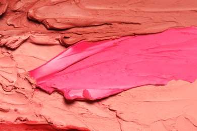 Texture of beautiful lipsticks as background, closeup