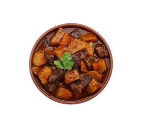 Delicious beef stew with carrots, parsley and potatoes on white background, top view