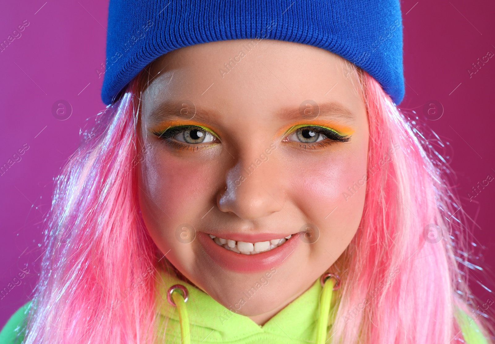 Photo of Portrait of cute indie girl on violet background, closeup