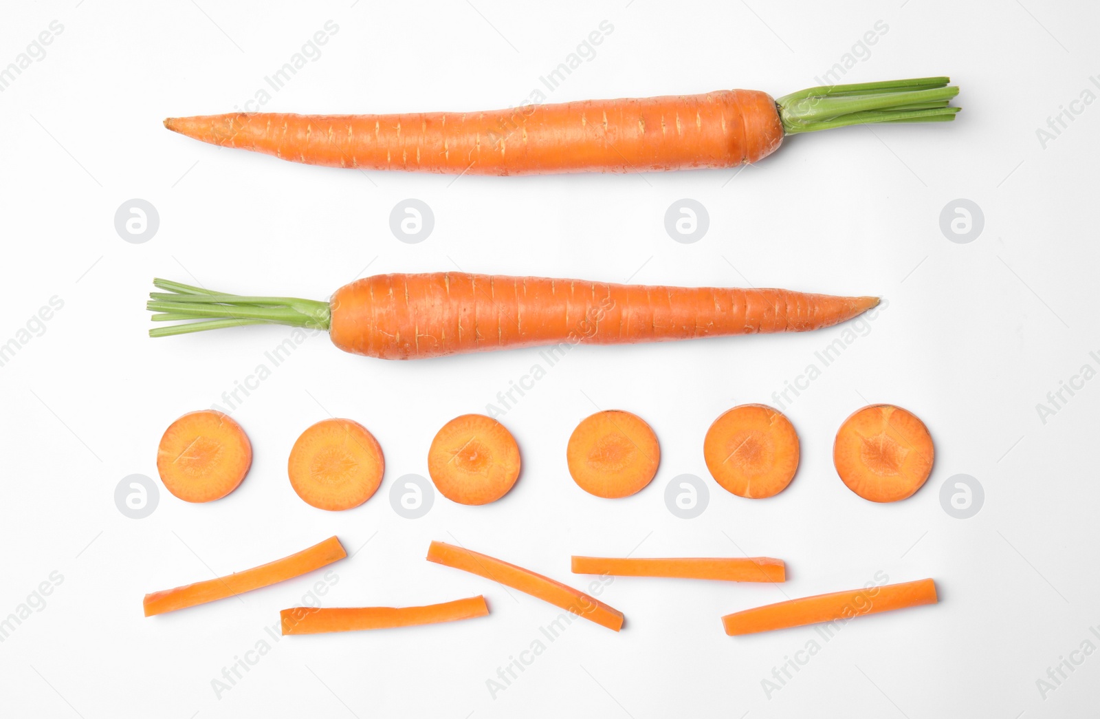 Photo of Whole and cut fresh carrots on white background