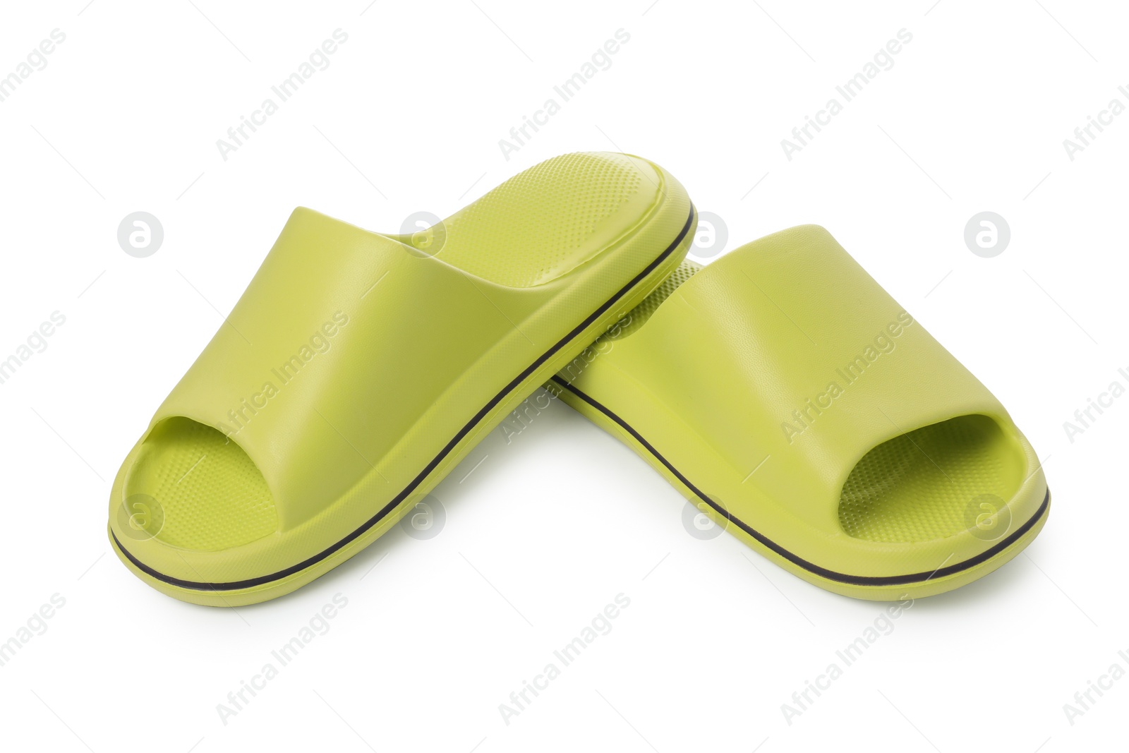 Photo of Pair of green rubber slippers isolated on white