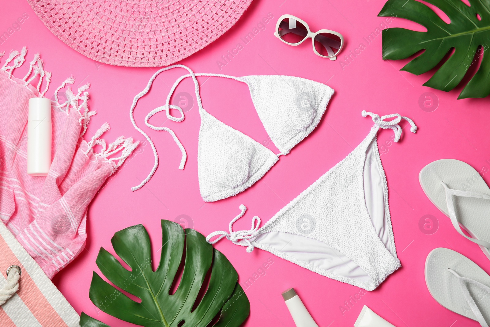 Photo of Flat lay composition with stylish bikini on color background