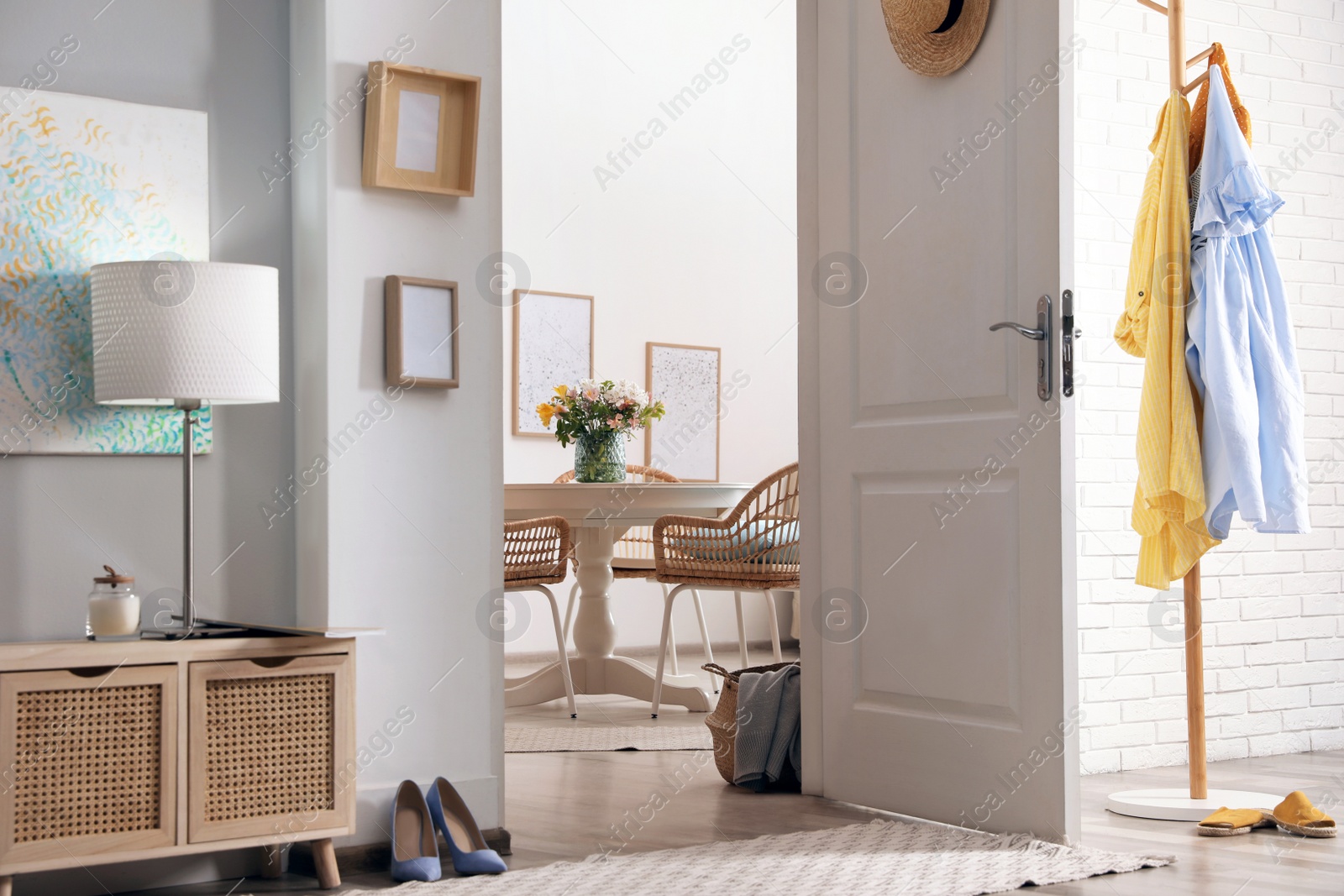 Photo of Light hallway with open door to room. Interior design