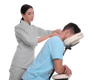 Photo of Man receiving massage in modern chair on white background