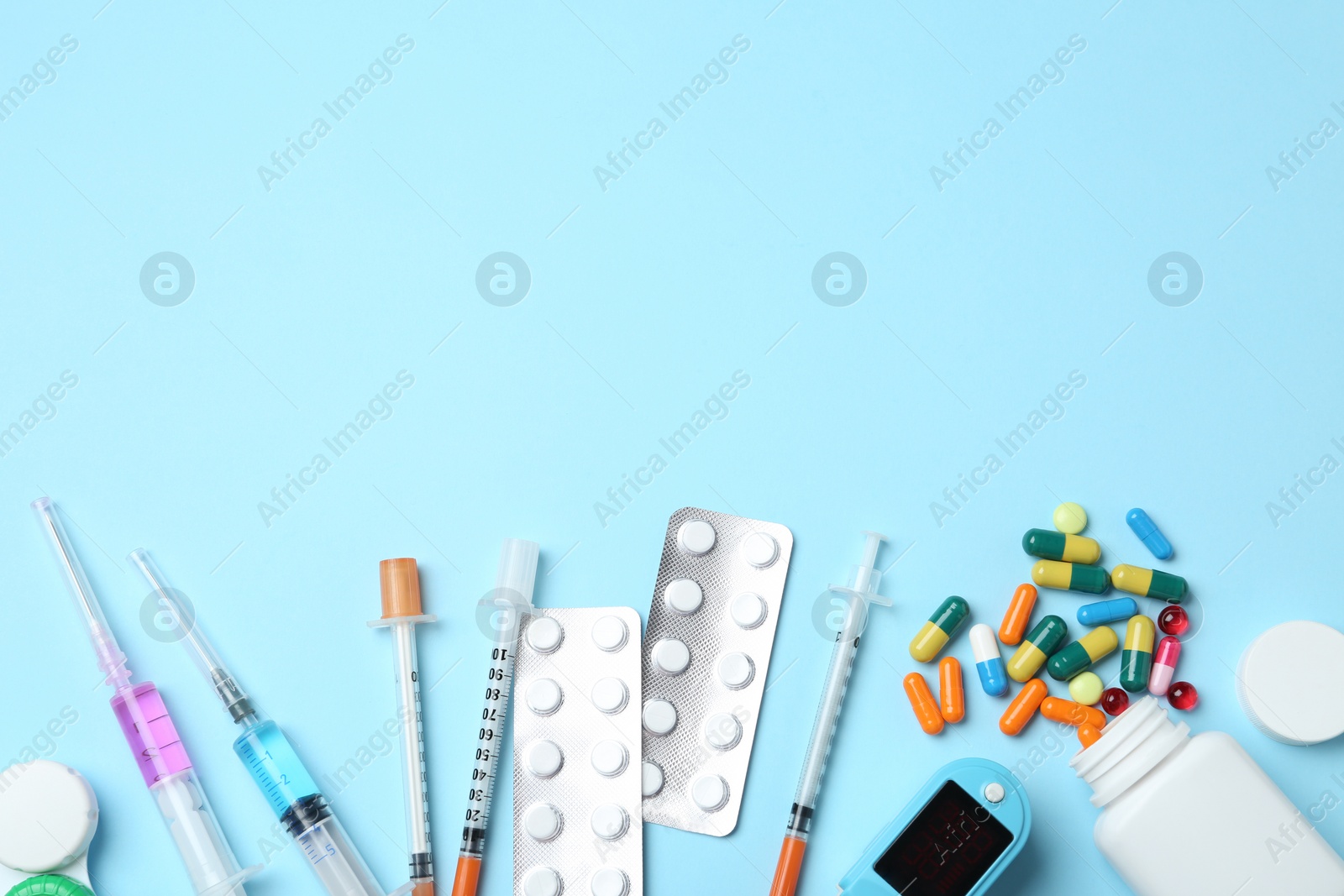 Photo of Flat lay composition with different medical objects and space for text on color background