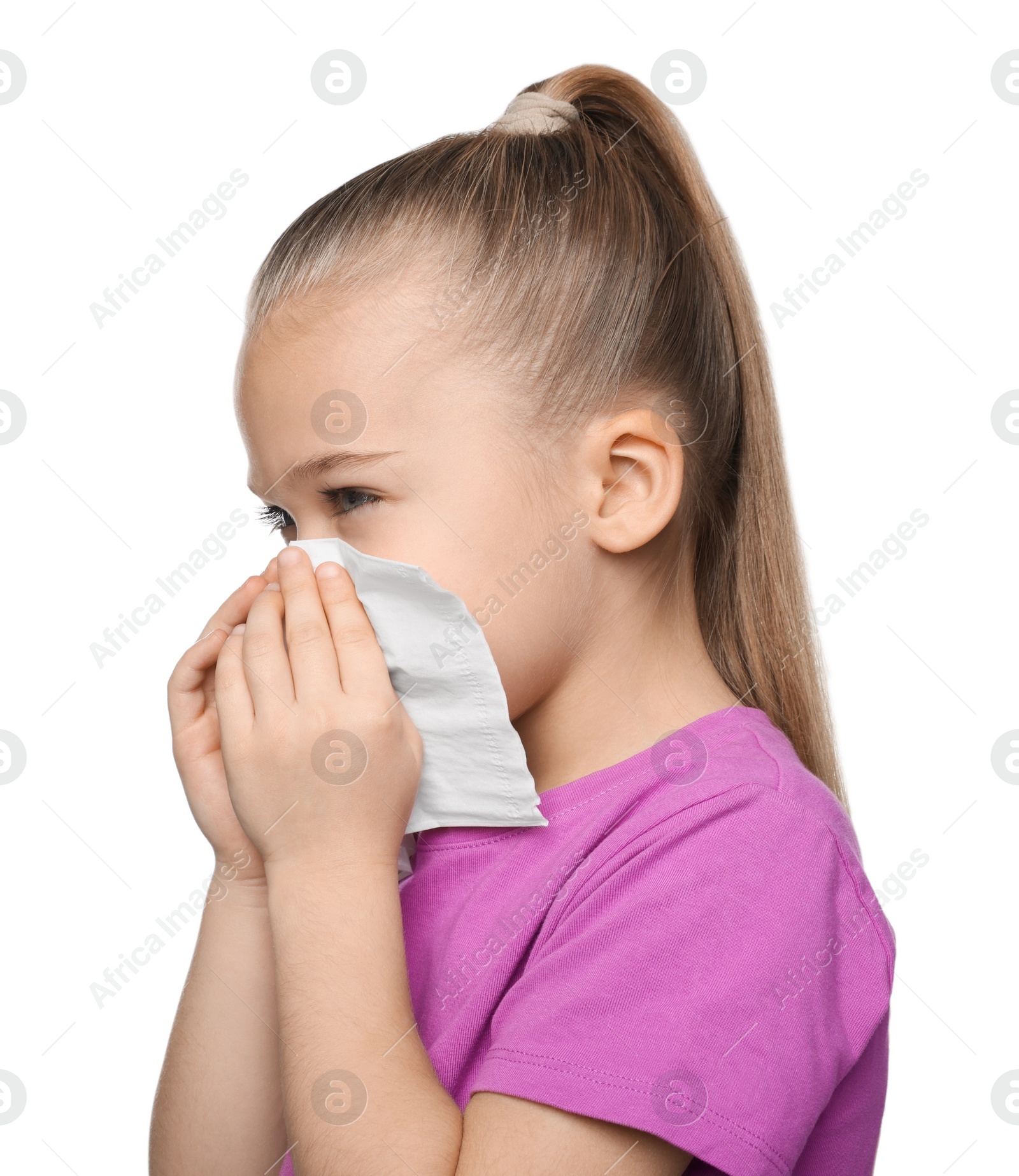 Photo of Sick girl blowing nose in tissue on white background. Cold symptoms