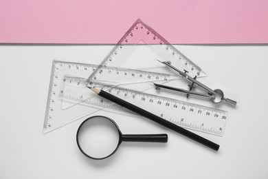 Photo of Flat lay composition with different rulers, pencil and compass on color background