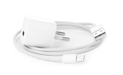 USB charge cable and power adapter on white background. Modern technology