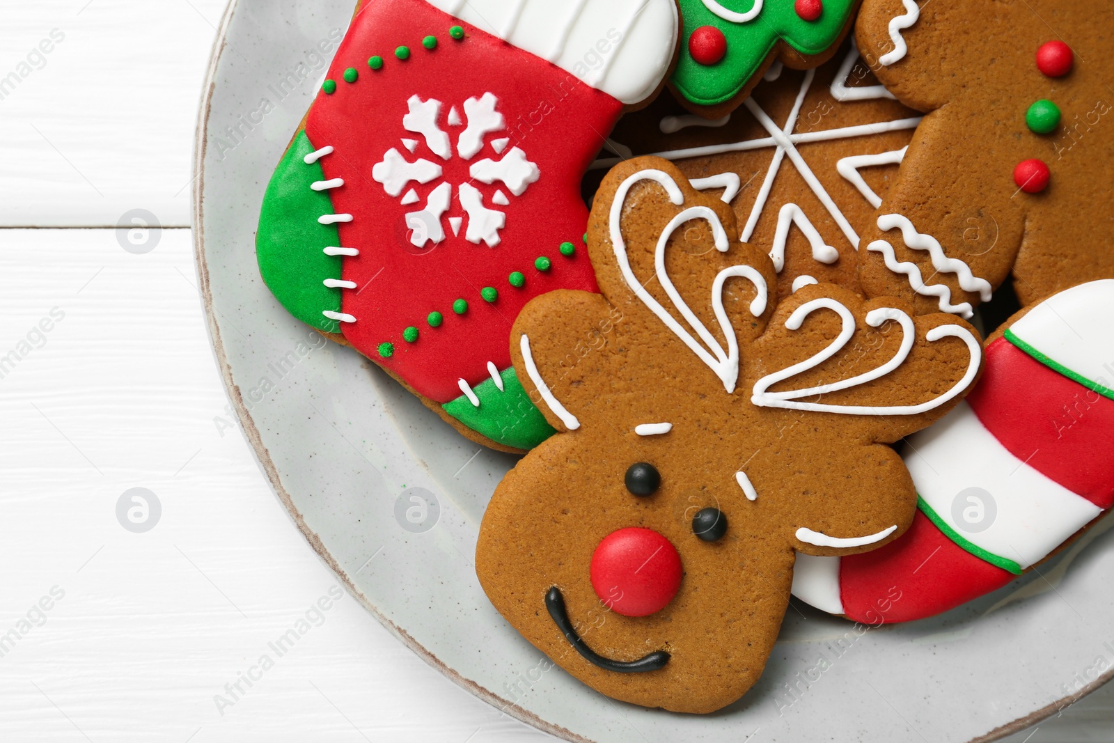 Photo of Tasty homemade Christmas cookies on white wooden table, top view. Space for text