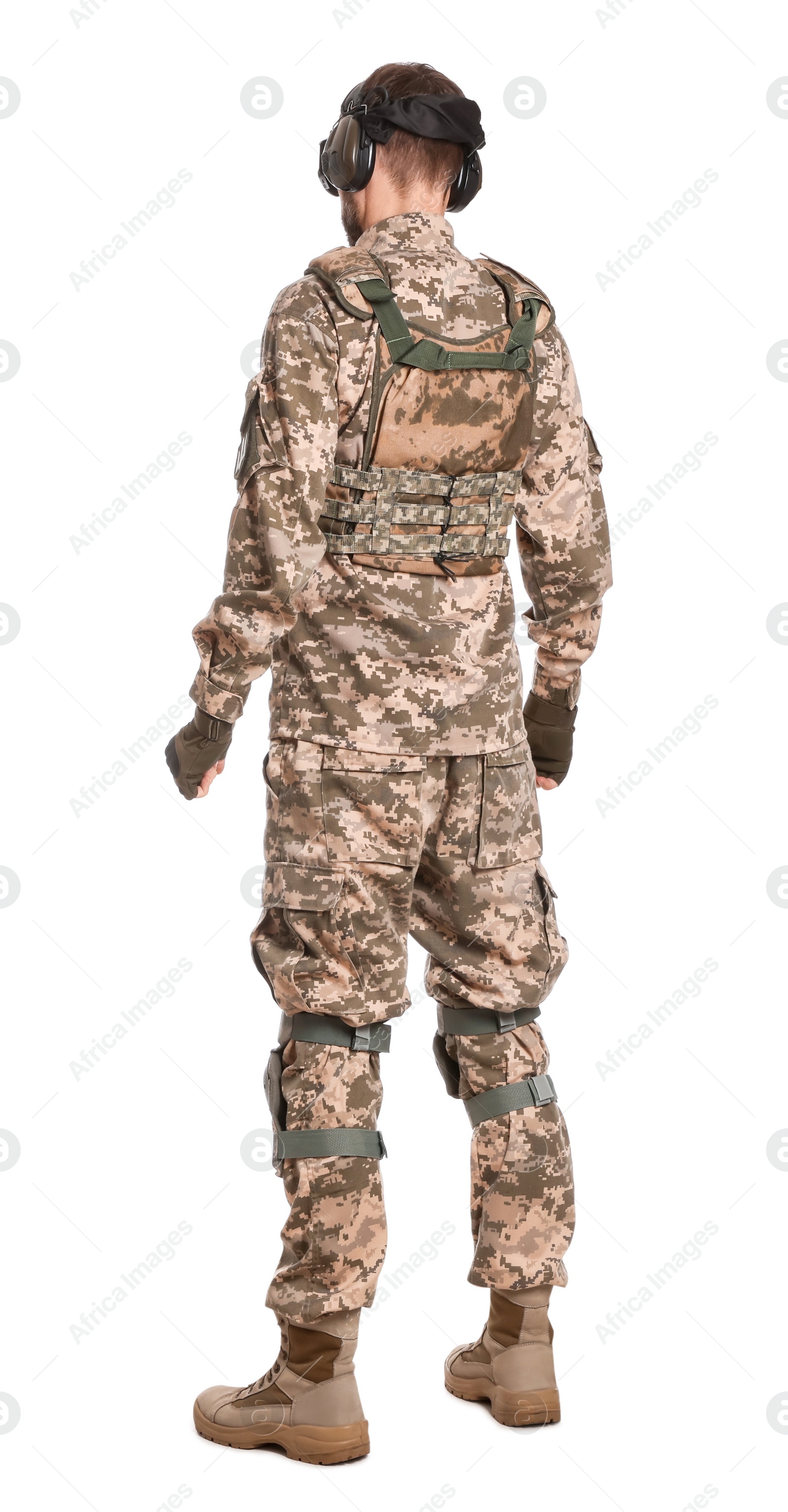 Photo of Soldier in Ukrainian military uniform and active tactical headphones on white background