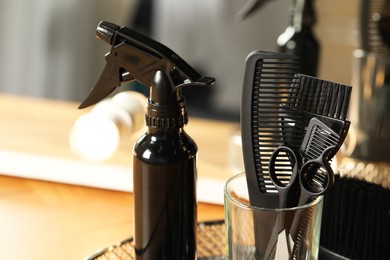 Photo of Set of hairdresser tools in salon, closeup. Space for text