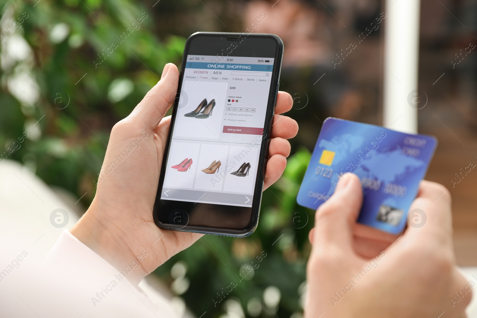 Photo of Woman with credit card using smartphone for online shopping indoors, closeup