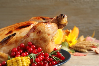 Photo of Plate with delicious turkey on wooden background, closeup. Happy Thanksgiving day