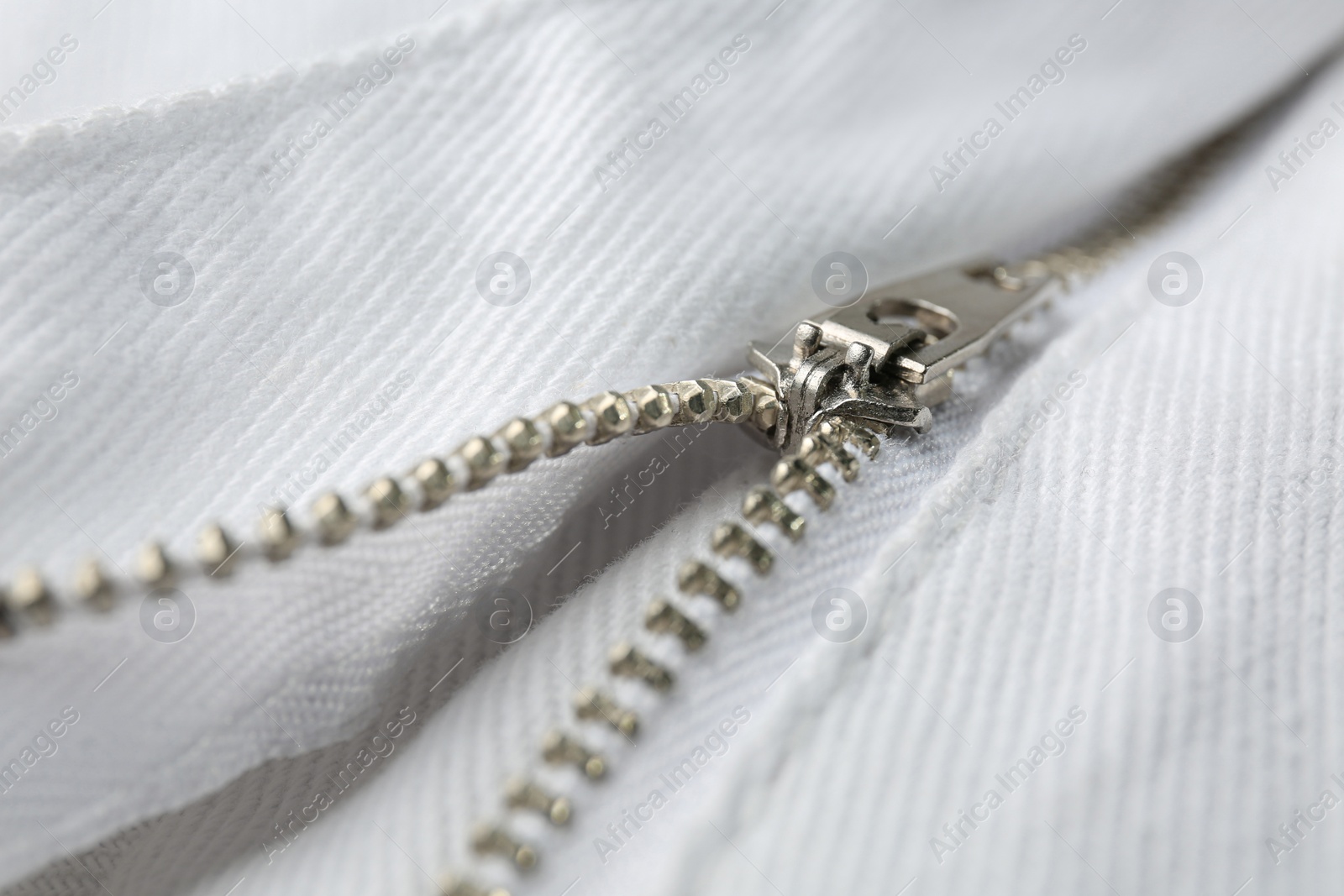 Photo of White jacket with zipper as background, closeup view