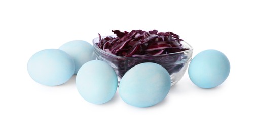Light blue Easter eggs painted with natural dye and red shredded cabbage on white background