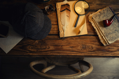 Photo of Flat lay composition with vintage detective items on wooden table