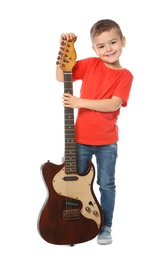 Little boy with electric guitar on white background