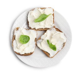Photo of Bread with cream cheese and basil on white background, top view