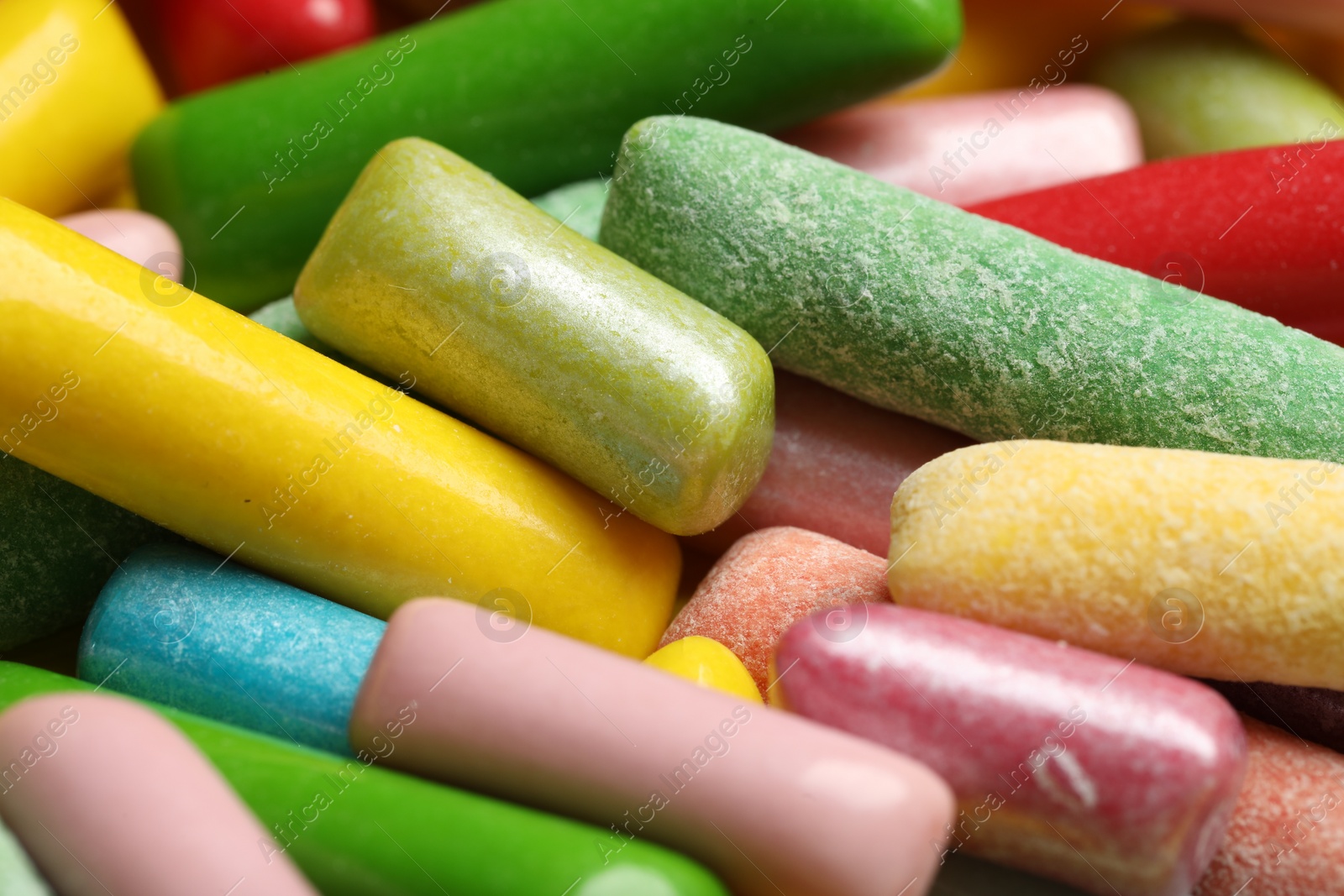 Photo of Many tasty bubble gums as background, closeup