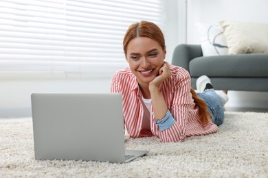 Woman having video chat via laptop at home