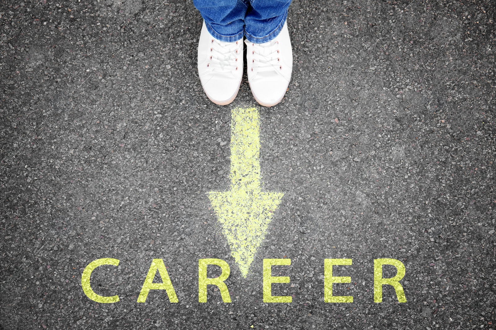 Image of Woman standing near arrow on asphalt, top view. Career choice concept