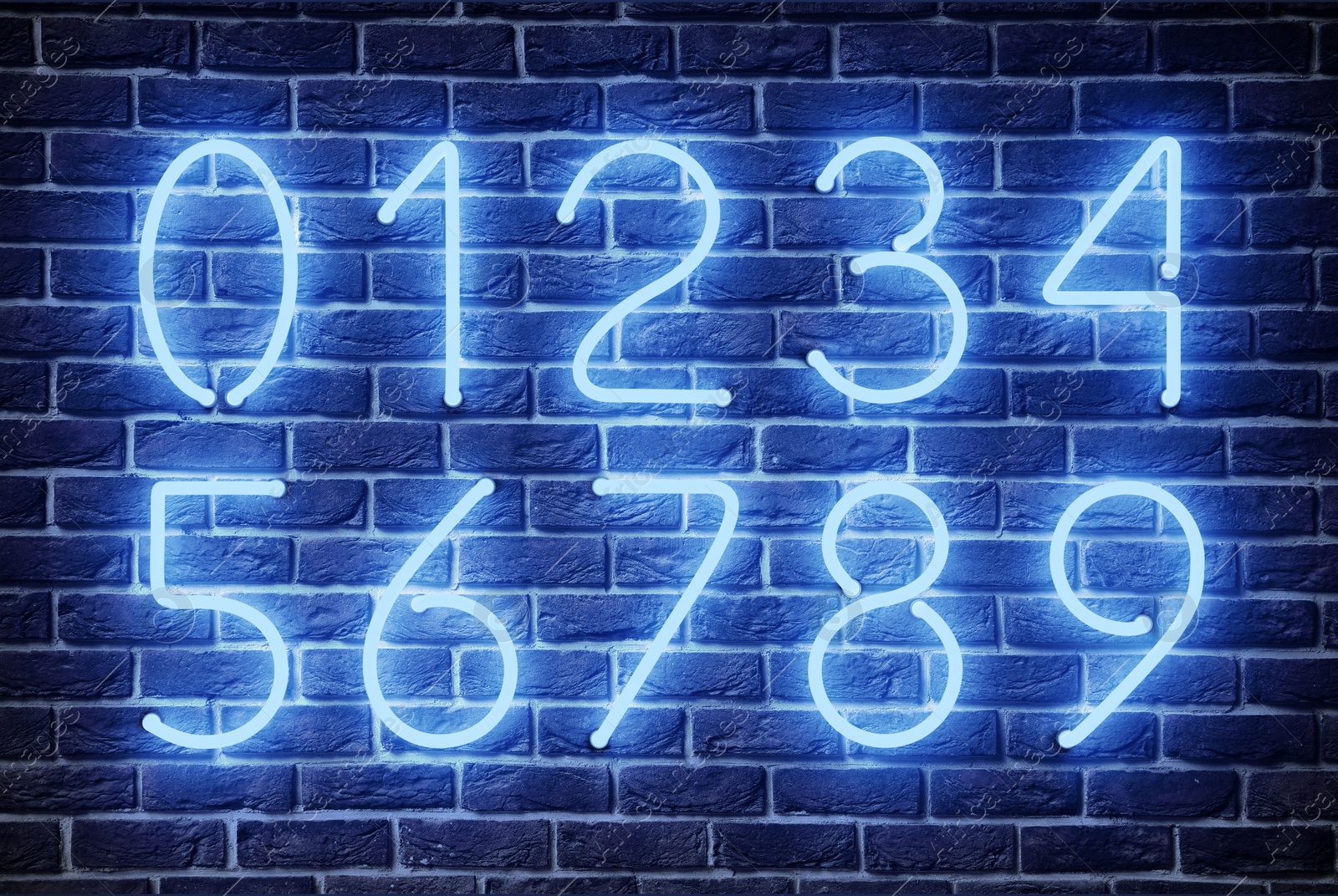 Image of Glowing neon number signs on brick wall